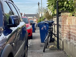 Cars parked on pavement in Oxford